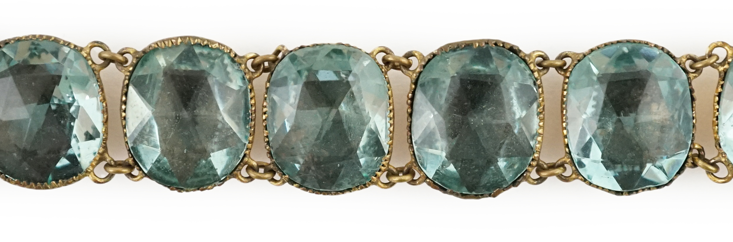 A rare 18th century 'Queen Anne' gilt metal and foil backed aquamarine paste bracelet